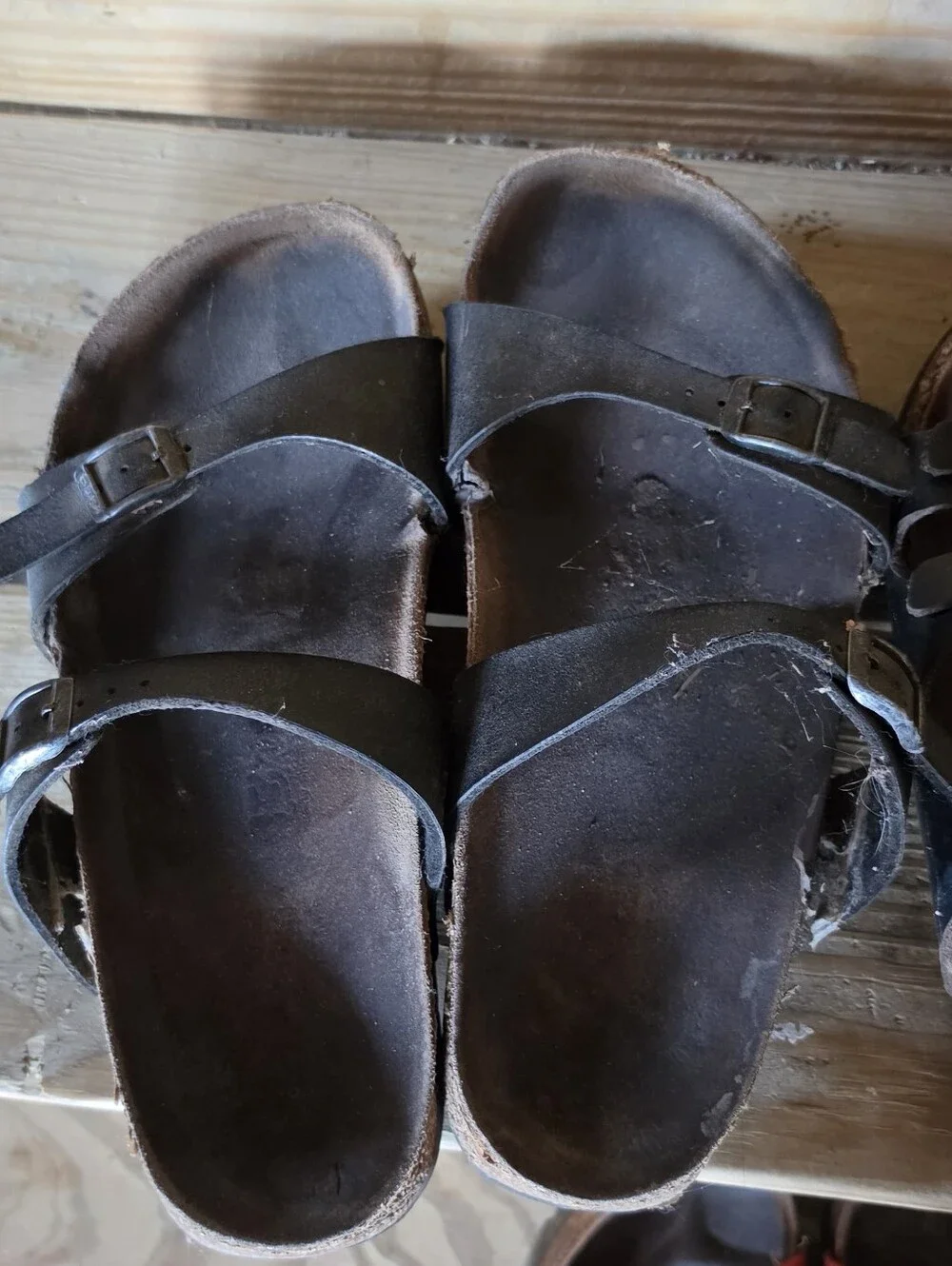 4 Pairs Size 39 Birkenstock sandals.  Very Worn.  Need Repairs.  Good Straps.